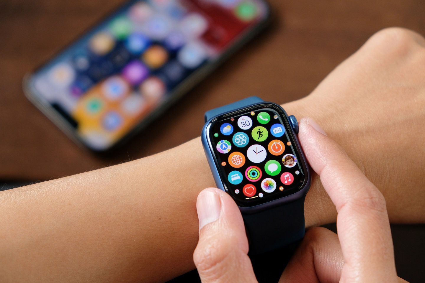 A person opearting Apple Watch 7 on wrist