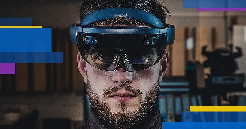 A bearded man wearing Microsoft Hololens AR smart glassess