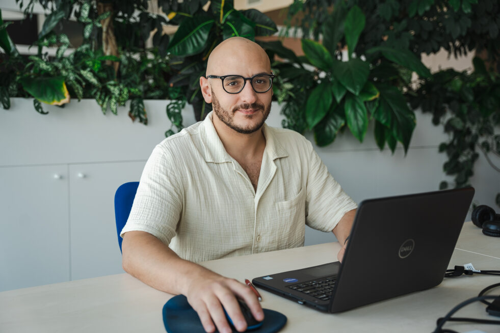 Giuseppe Felice at a notebook in the Resco office