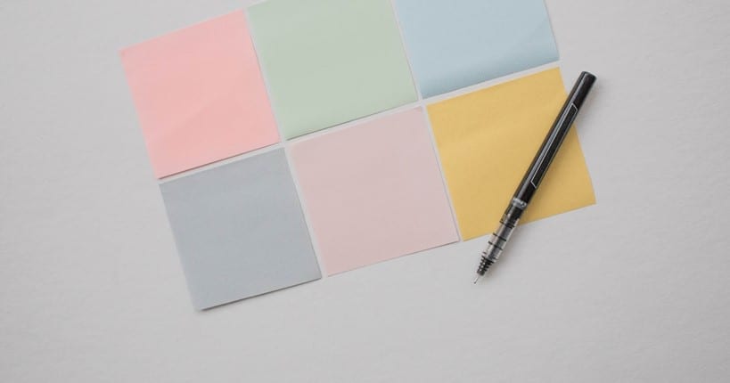 colorful post it with a pen